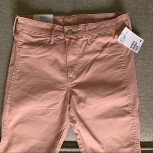 Blush pink skinny ankle jeans